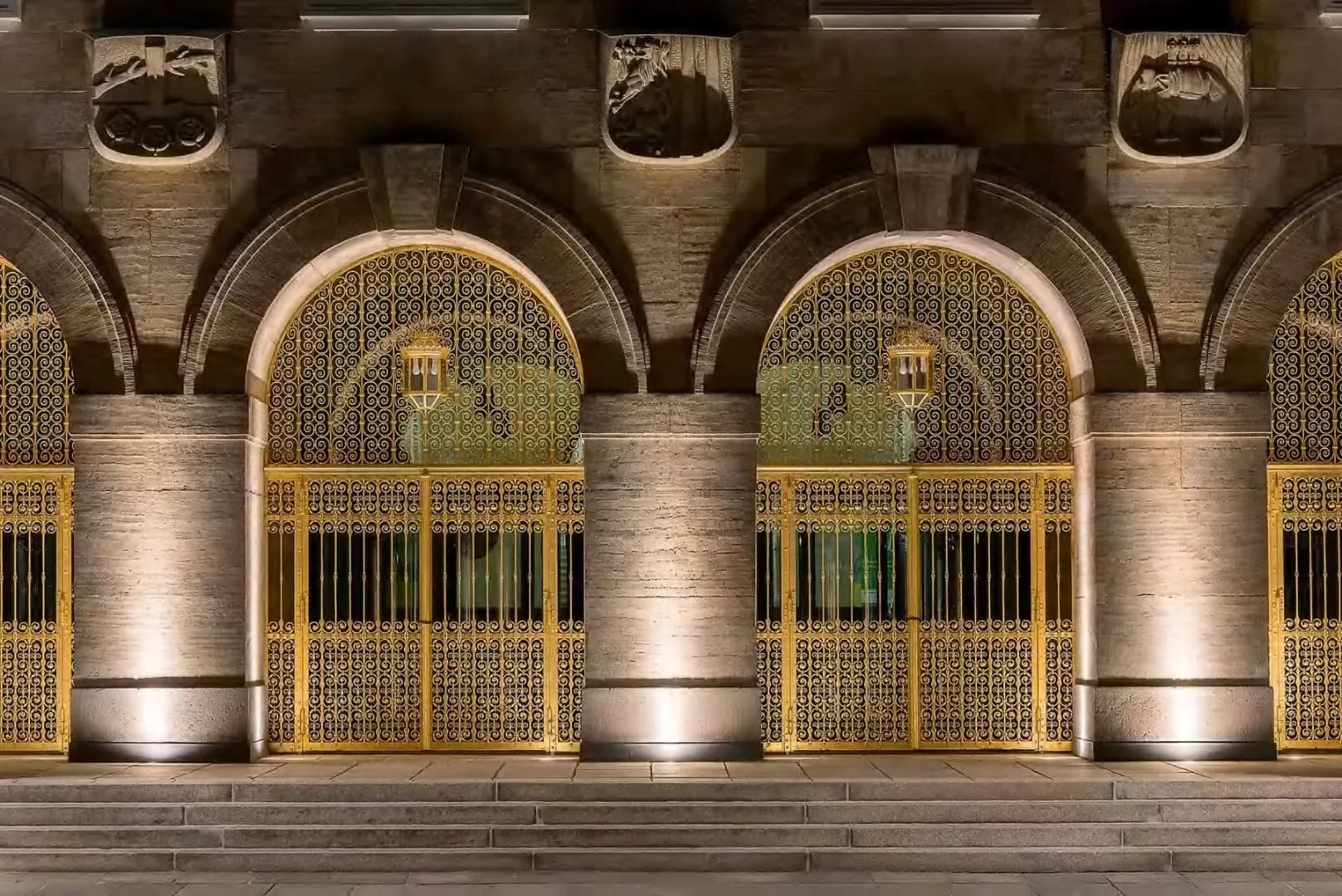 A stone facade washed evenly from ground mounted uplights