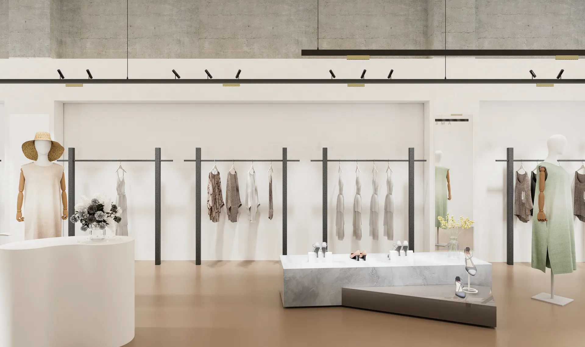 A boutique lit from black track spotlights aimed onto the clothing rails, with linear accents along the track