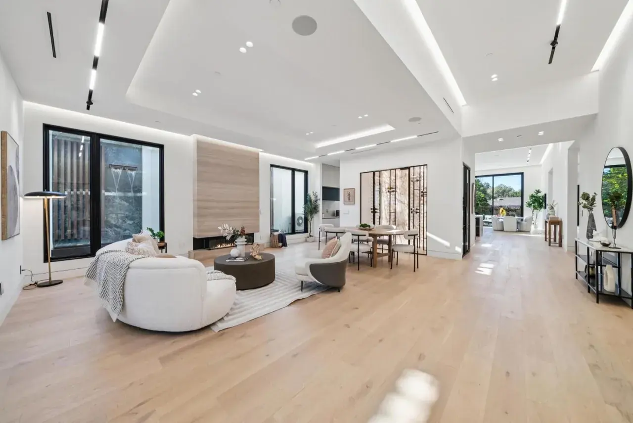 Open living space with recessed linear runs set into the ceiling